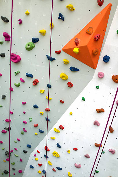 istock Indoor rock climbing wall background 519430250