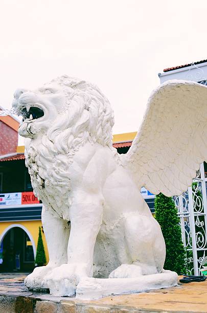 lion statue sits on it's pedestal