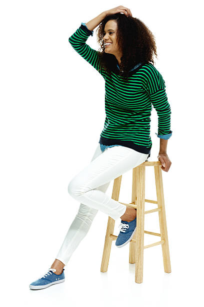 istock Cheerful woman sitting and looking away 519432272
