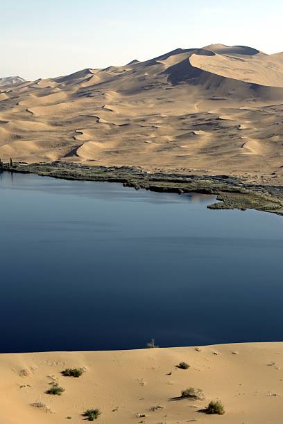 istock Lake in Badain Jaran desert, Inner Mongolia, China 519432884