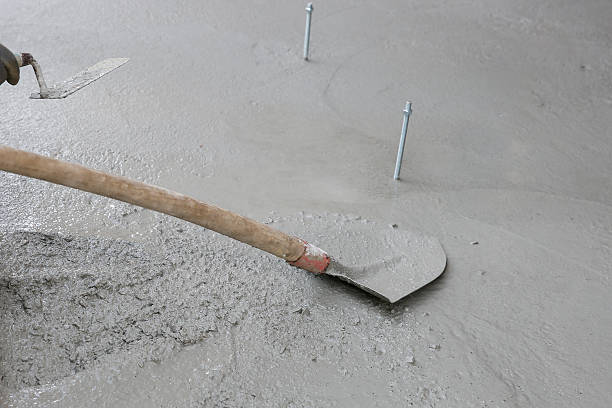 istock Mason holding masons trowel and shovel 519432948