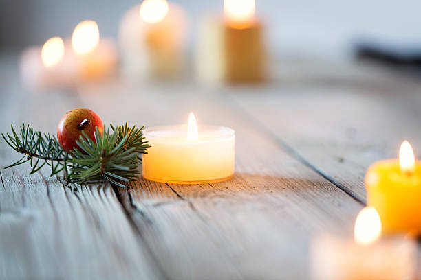istock christmas background wood and candle light 519433987