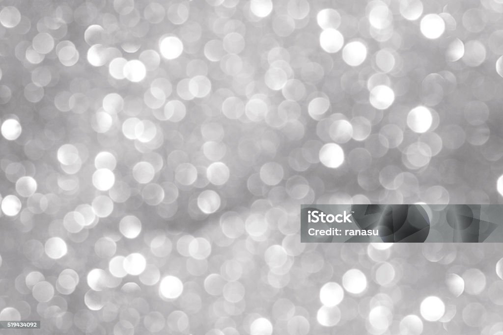 Silver Christmas background Silver Christmas background with various bokeh  Sequin Stock Photo