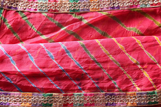 istock Indian bandhej saree cloth fabric texture 519434667