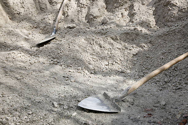 istock Shovels lying on a pile of construction material 519434712