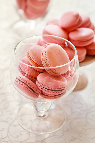 istock Macarons glass bowl on white background 519436319
