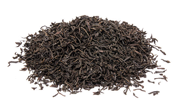 istock Dry black tea leaves isolated 519438369