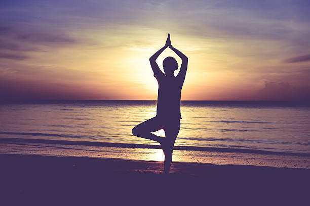 istock women playing yoga 519438423