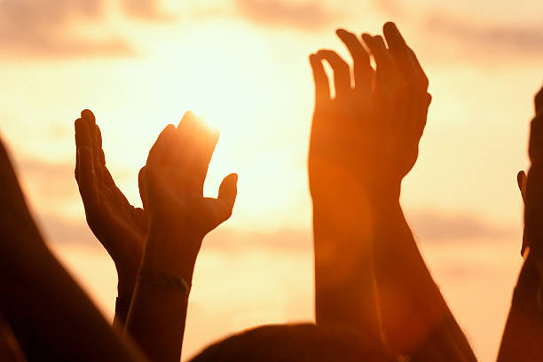 istock hands up in a open air rock festival 519438637
