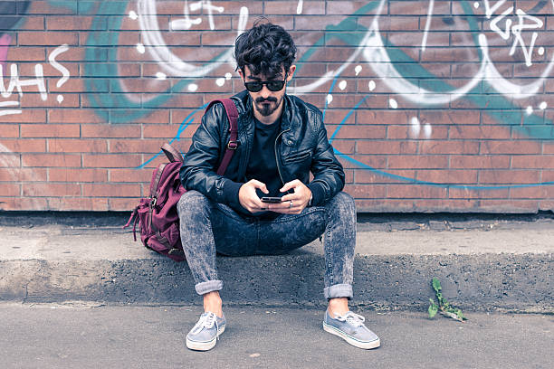 istock young man smartphone in the city 519438911