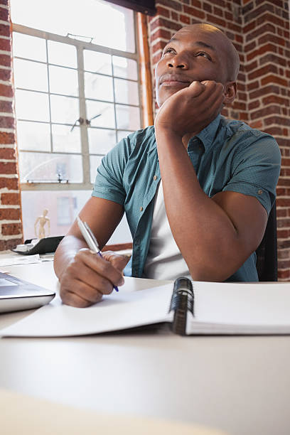 istock Casual businessman working at his desk 519440033