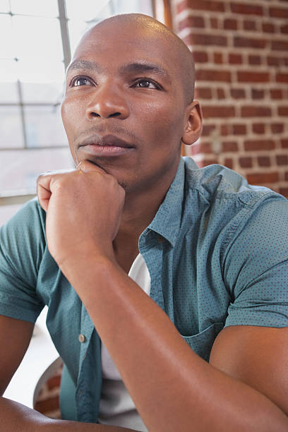 istock Casual businessman thinking at his desk 519440051