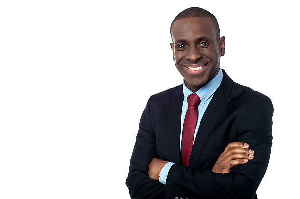 istock Smiling businessman with arms crossed 519454723