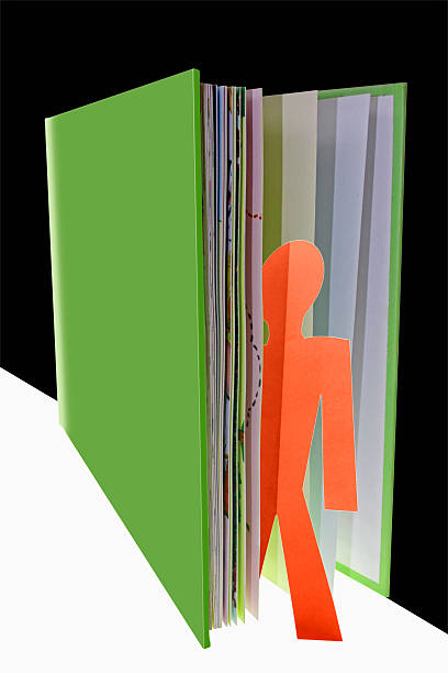 istock man coming out of book, education Concept 519456927