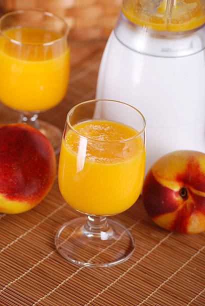 istock peach smoothie in the glass 519457829