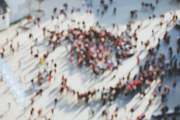 istock Blurred crowd of people 519460542