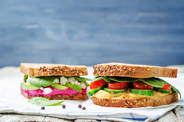 istock rye sandwiches with carrots and beetroot hummus and vegetables 519461234