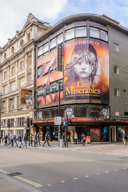 The Queens Theatre - London London, England - April 23, 2014: The Queens Theatre on Shaftesbury Avenue in London, UK. The theatre has been the home of the long running musical Les Miserables since 2004 when the show transferred from the Pallace theatre. soho billboard stock pictures, royalty-free photos & images