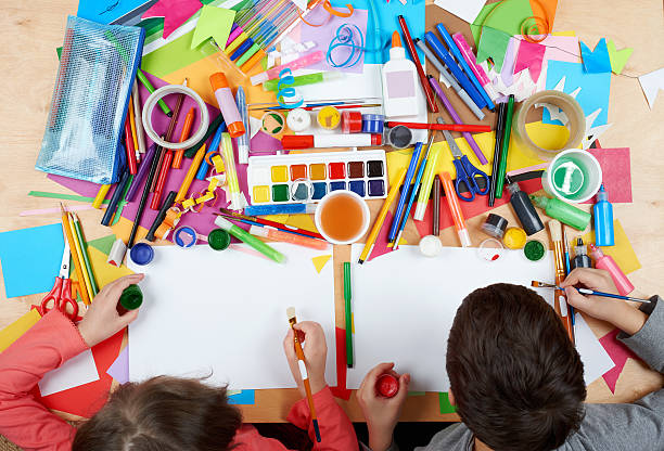 istock Child drawing top view. Artwork workplace with creative accessories. 519464158