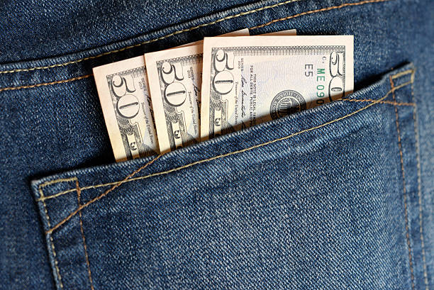 istock Money - US Dollar in jeans pocket 519465316