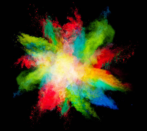 istock Explosion of colored powder on black background 519465458