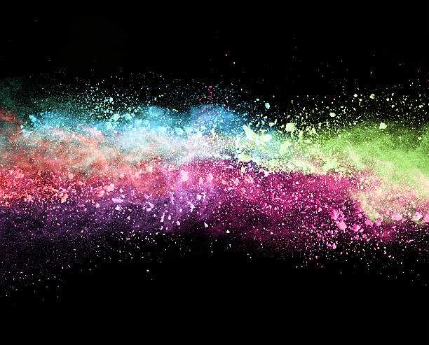 istock Explosion of colored powder on black background 519465888