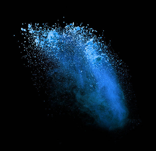 istock Explosion of blue powder on black background 519466894