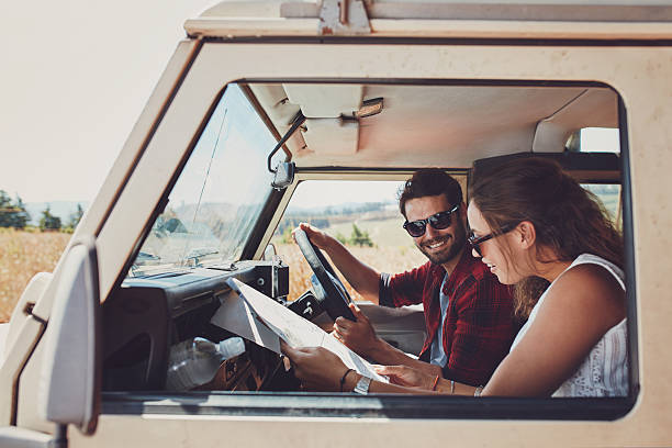 istock Couple looking at the map in their car 519467256
