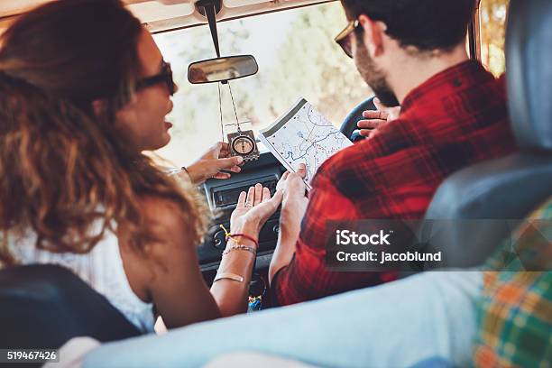 Couple Using Map To Decide Which Way To Go Stock Photo - Download Image Now - Adult, Adults Only, Adventure