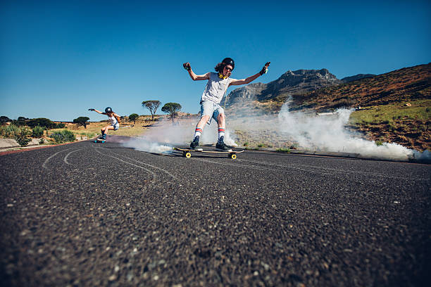 istock Young people skating down the street 519469394