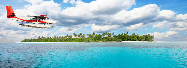 istock Sea plane flying above Maldives islands 519469608