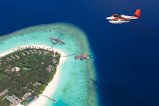 istock Sea plane flying above Maldives islands 519469678