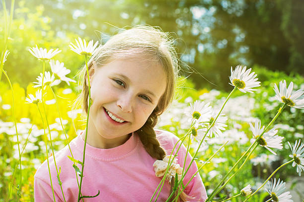 istock Beautiful young girl in a meadow 519470016