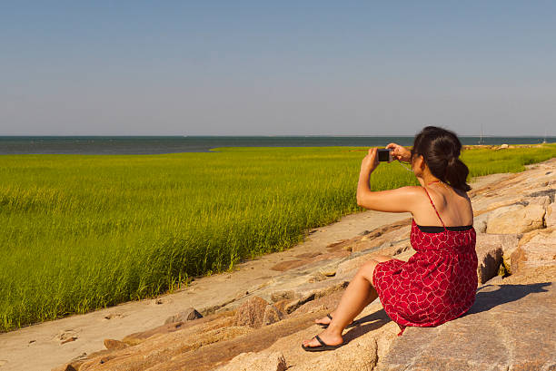 Korean Woman Photographing Beach Grass