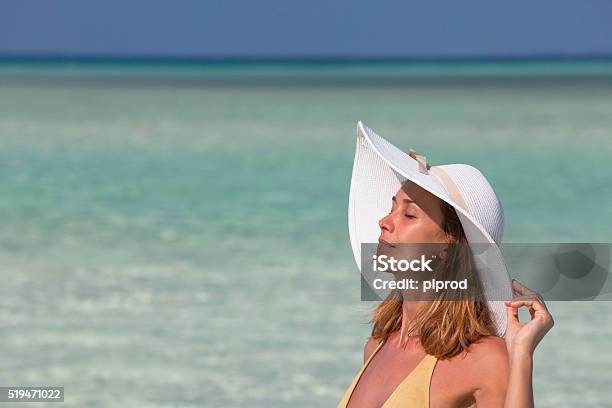 Face Of A Woman In The Sun In A Jersey Stock Photo - Download Image Now - Beach, Swimwear, Tan Line