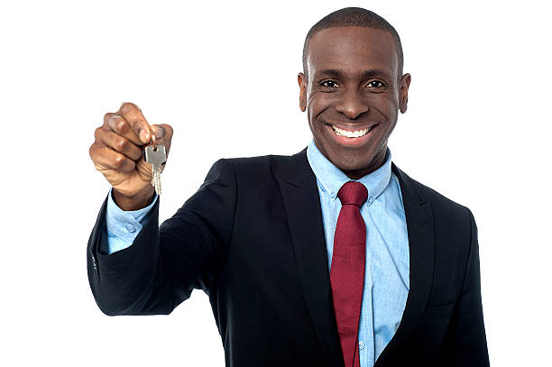istock African businessman holding a key 519471353