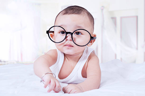 istock Cute baby boy wearing glasses 519471362
