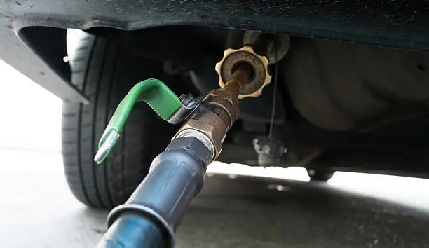 Photo of Refuel car at gas station filled with fuel LPG gas