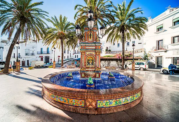 The main square in Vejer de la Frontera- Plaza de Espana, featuring a beautiful fountain with colorful ceramic tiles