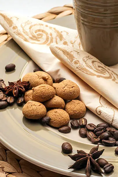 Pastries, coffee beans and spices in close-up with dishes