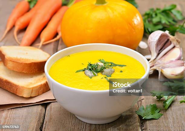 Pumpkin Cream Soup On Wooden Table Stock Photo - Download Image Now - Appetizer, Autumn, Bowl