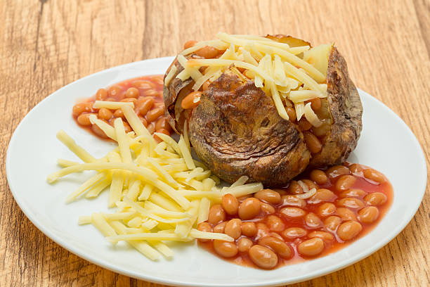 istock Jacket potato with baked beans and grated cheese 519474101