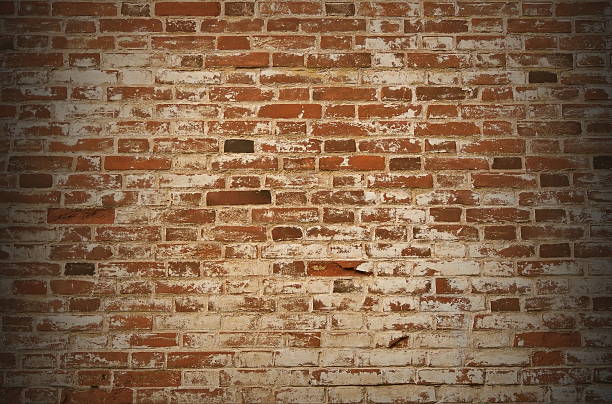 istock Old brown brick wall in the vignette. 519474906