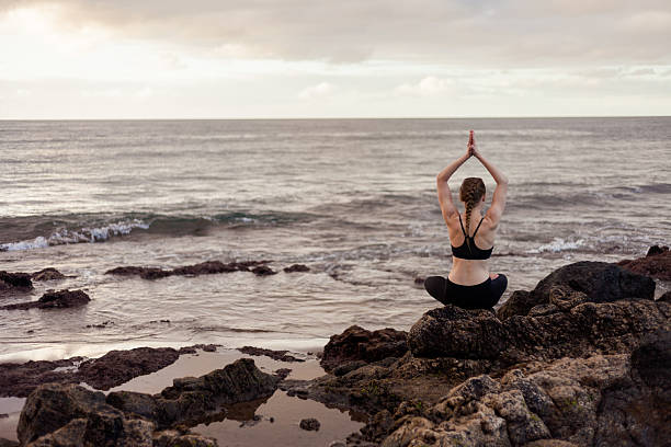 istock Sunrise yoga session on beach 519476122