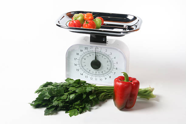 istock kitchen scale with healthy food 519476647