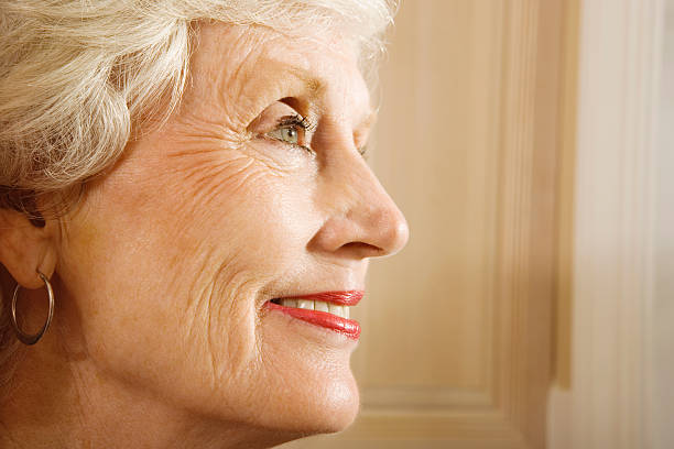 istock Senior woman smiling, close-up 519477027