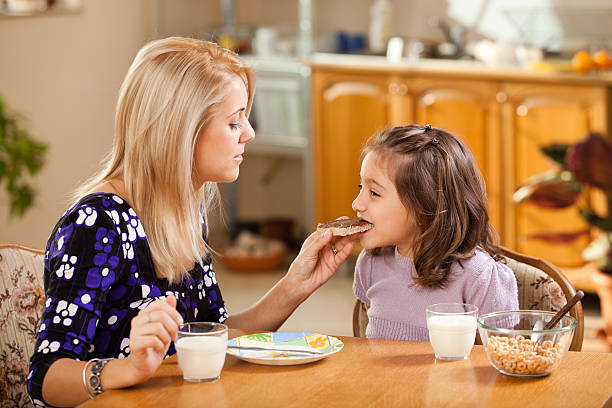 istock little girl eating chocolate cream 519477347