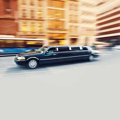 Black Limousine speeding in Manhattan, New York City  - panning motion blur technique