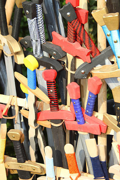 istock wooden swords in a medieval shop 519487959