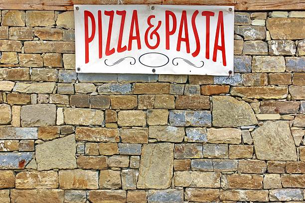 istock Italian Food Sign on Old Stone Wall 519488115